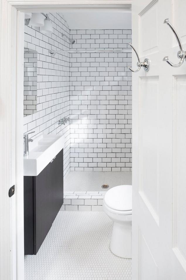 White subway tile and penny mosaic bathroom
